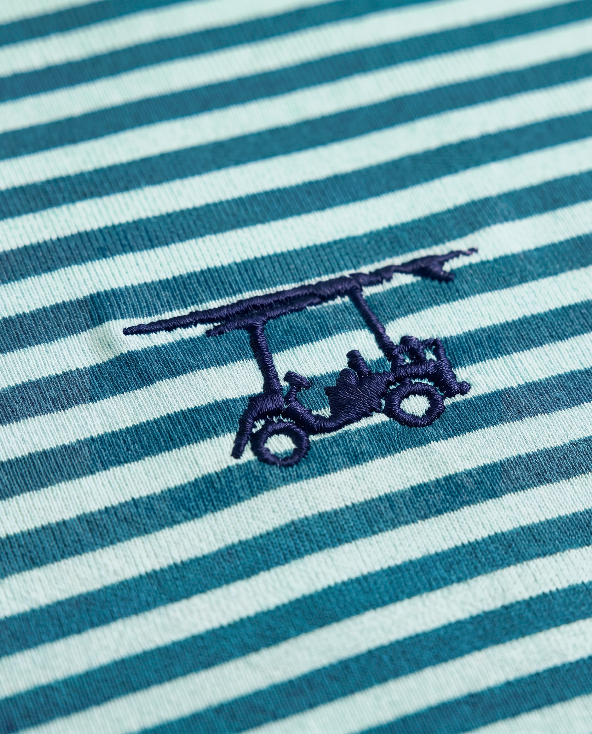 Albatross Polo Lagoon/Seaglass Feeder Stripe logo detail