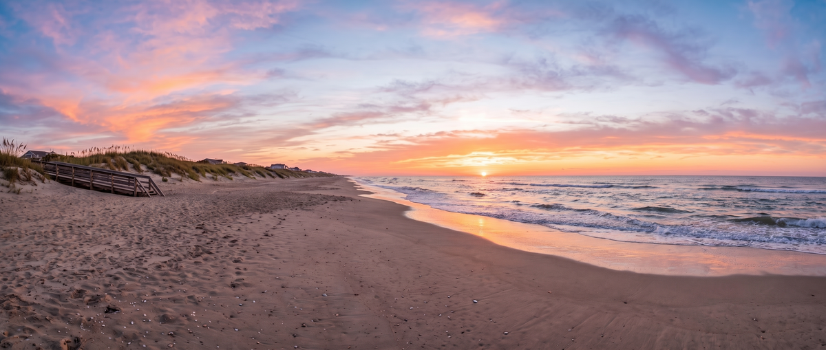 Sunrise over the beach, dune walkover and open ocean on the North Carolina coast